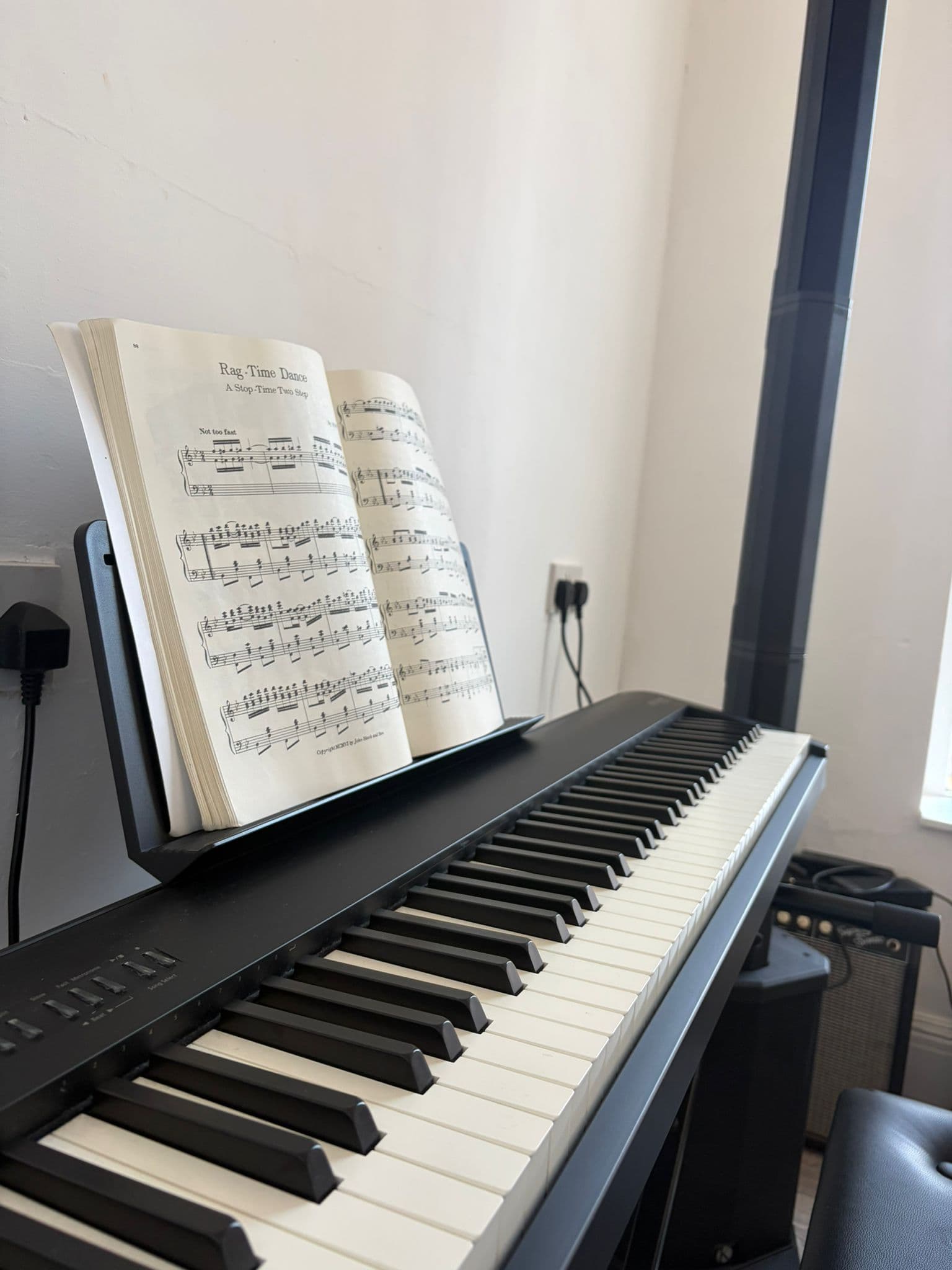 A piano and open book of music